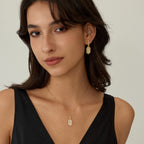 Innocence Age Statement Shield Huggie Earrings
