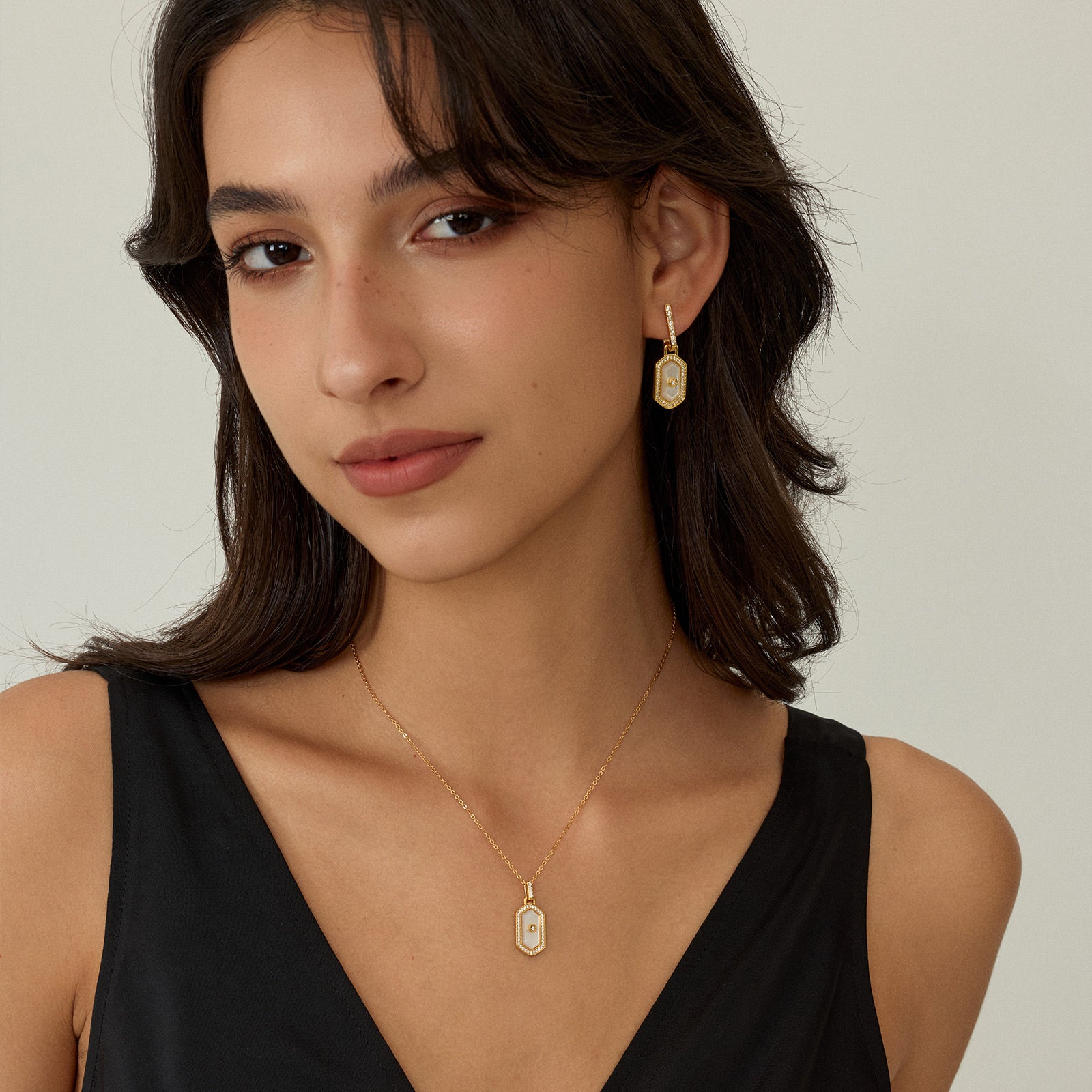 Innocence Age Statement Shield Huggie Earrings